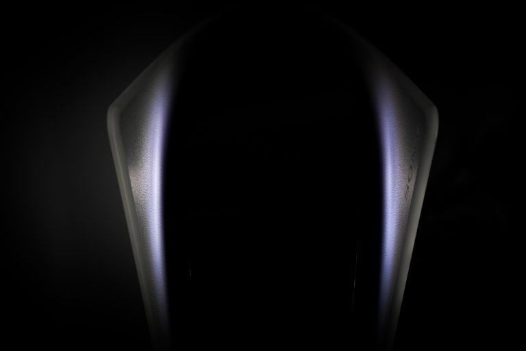 Abstracte close-up van PlayStation 5 console in het donker